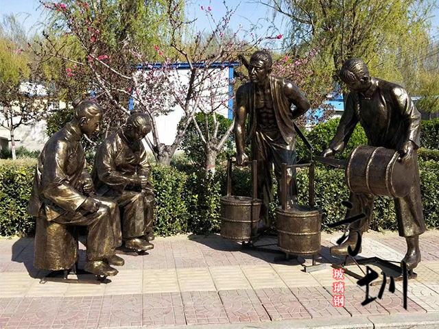 仿铜红色文化玻璃钢挑水雕塑